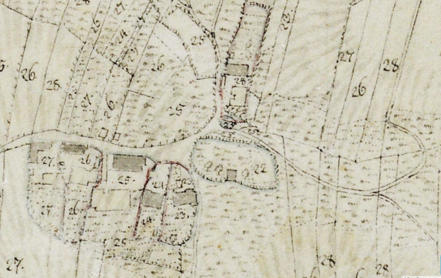 Detailierte alte Stadtkarte, die Gebäude, Straßen und Text zeigt, mit einer geplanten Entwicklung unten vermerkt.